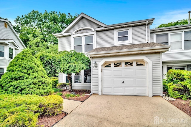 207 Manahan Rd, East Brunswick, NJ 08816 - traditional-style house featuring driveway and a garage