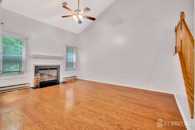 207 Manahan Rd, East Brunswick, NJ 08816 - unfurnished living room featuring high vaulted ceiling, ceiling fan, a baseboard radiator, a fireplace with flush hearth, and wood finished floors