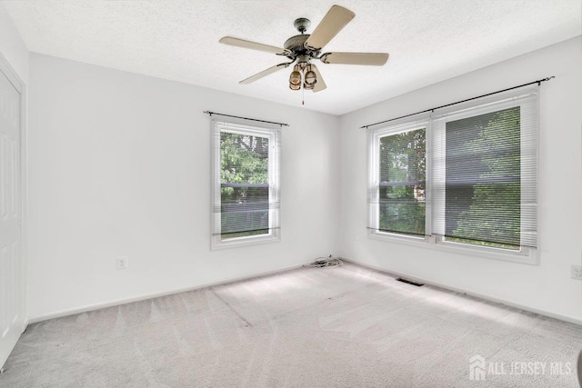 207 Manahan Rd, East Brunswick, NJ 08816 - carpeted empty room featuring a textured ceiling and a ceiling fan