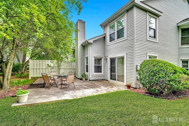 207 Manahan Rd, East Brunswick, NJ 08816 - rear view of house featuring a chimney and a patio