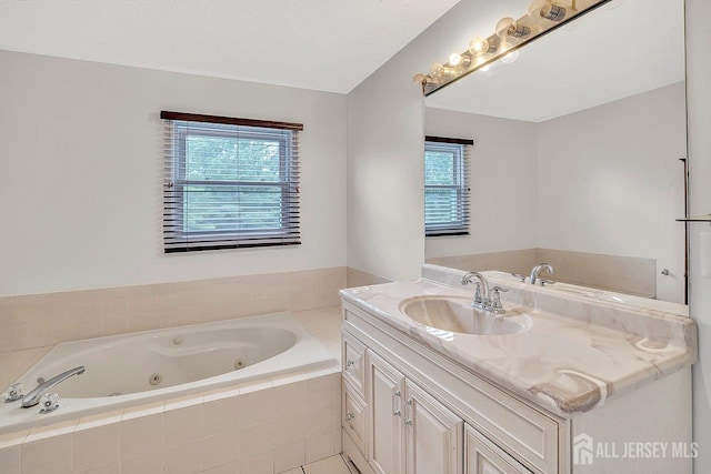 207 Manahan Rd, East Brunswick, NJ 08816 - full bath with vanity, a tub with jets, and plenty of natural light