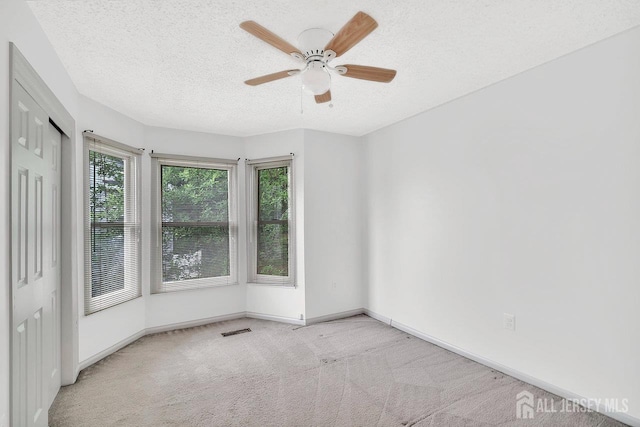 207 Manahan Rd, East Brunswick, NJ 08816 - spare room featuring carpet flooring, ceiling fan, and a textured ceiling