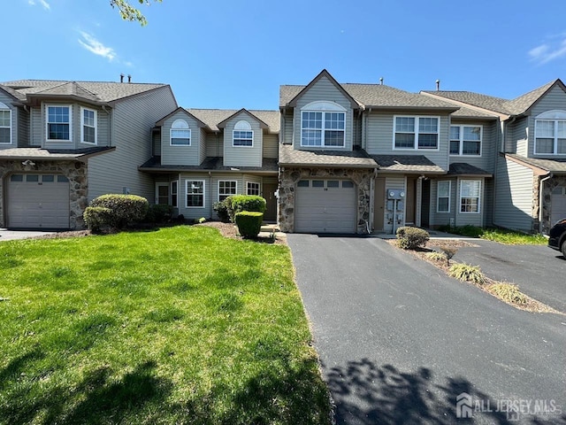156 Nebula Rd, Piscataway, NJ 08854 - view of property with driveway, a front yard, an attached garage, and stone siding