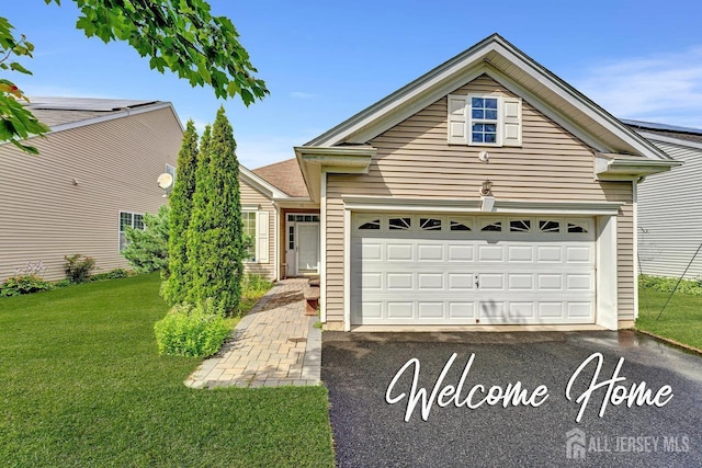 32 Prusakowski Blvd, Sayreville, NJ 08859 - single story home with driveway, a front yard, and an attached garage