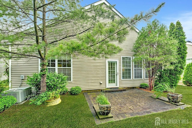 32 Prusakowski Blvd, Sayreville, NJ 08859 - rear view of house with a patio area and a yard
