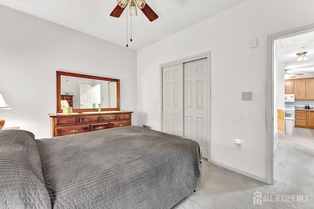 32 Prusakowski Blvd, Sayreville, NJ 08859 - bedroom with light carpet, attic access, a closet, and ceiling fan