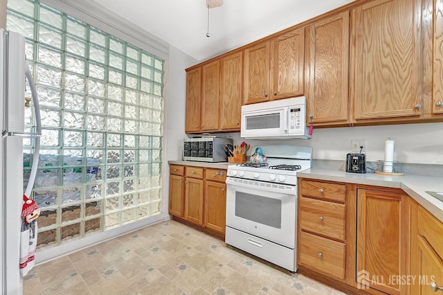 32 Prusakowski Blvd, Sayreville, NJ 08859 - kitchen with white appliances, light countertops, and brown cabinets