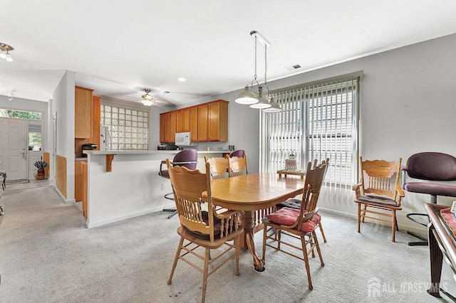 32 Prusakowski Blvd, Sayreville, NJ 08859 - dining room with a ceiling fan and light colored carpet