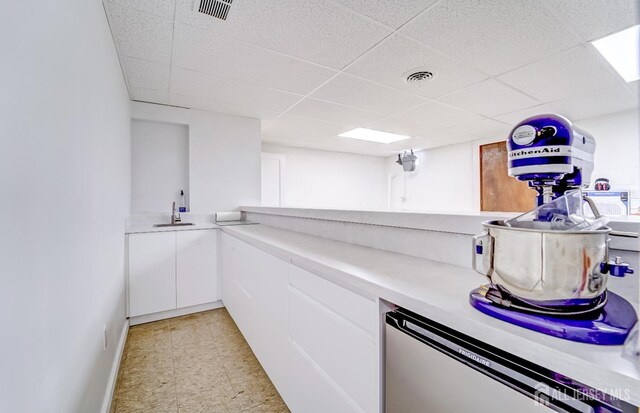 1580 Mountain Top Rd, Bridgewater, NJ 08807 - bar area featuring a sink, a drop ceiling, dishwashing machine, and baseboards