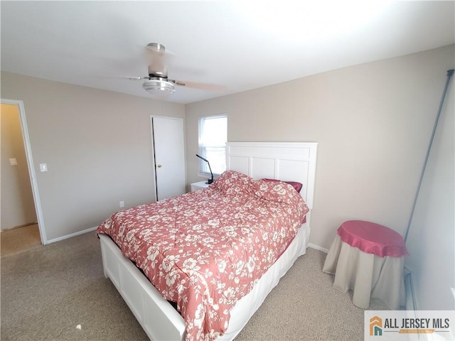 bedroom featuring ceiling fan and carpet flooring