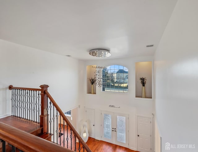 interior space featuring hardwood / wood-style floors and french doors