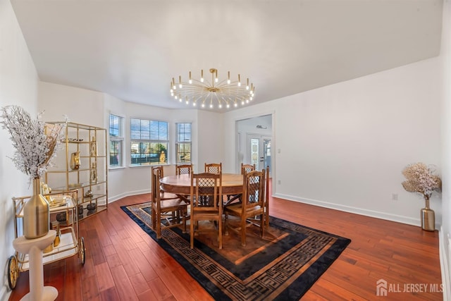 dining area with french doors, an inviting chandelier, and hardwood / wood-style flooring