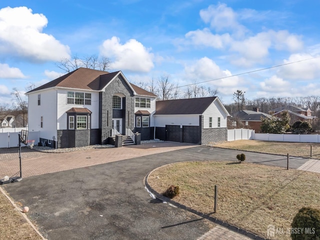 view of property featuring a front lawn