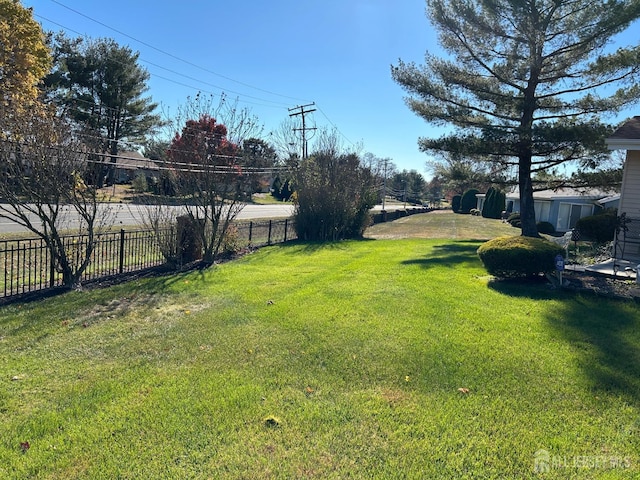 view of yard with fence