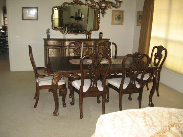 view of carpeted dining space