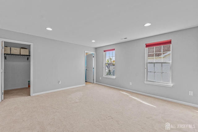 unfurnished bedroom featuring carpet floors, recessed lighting, and baseboards