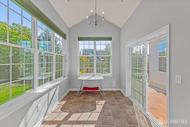 unfurnished sunroom featuring vaulted ceiling and an inviting chandelier