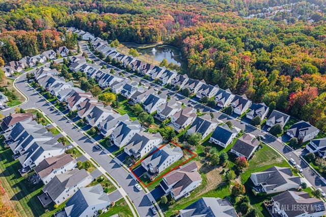 aerial view with a water view and a residential view