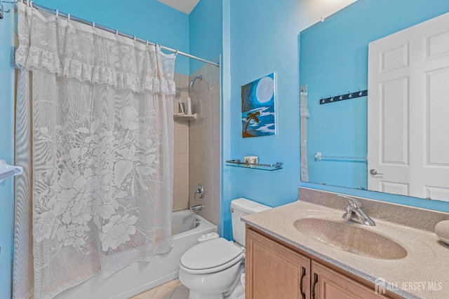 bathroom with shower / bath combination with curtain, vanity, toilet, and tile patterned floors