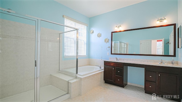 full bathroom featuring double vanity, a garden tub, tile patterned flooring, a shower stall, and a sink