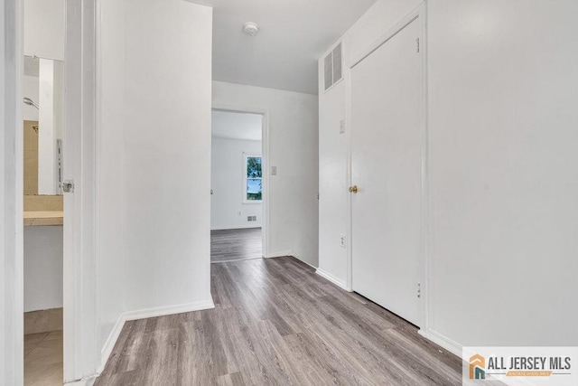 17 Begonia Ct, Sayreville, NJ 08872 - hall featuring wood finished floors and baseboards