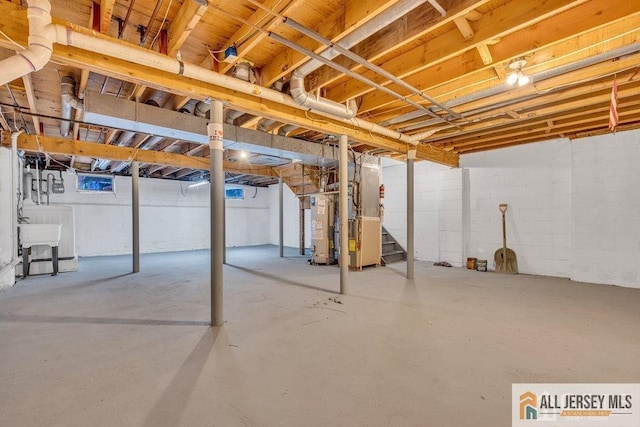 17 Begonia Ct, Sayreville, NJ 08872 - unfinished basement featuring stairs, heating unit, water heater, and washer / dryer