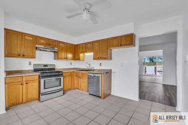 17 Begonia Ct, Sayreville, NJ 08872 - kitchen featuring stainless steel appliances, under cabinet range hood, a ceiling fan, light tile patterned flooring, and brown cabinetry