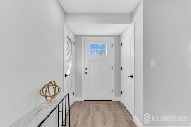 doorway with light hardwood / wood-style floors