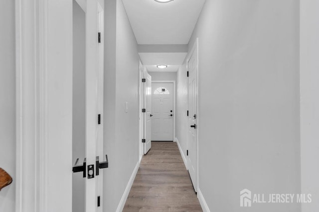 hallway featuring light wood-type flooring