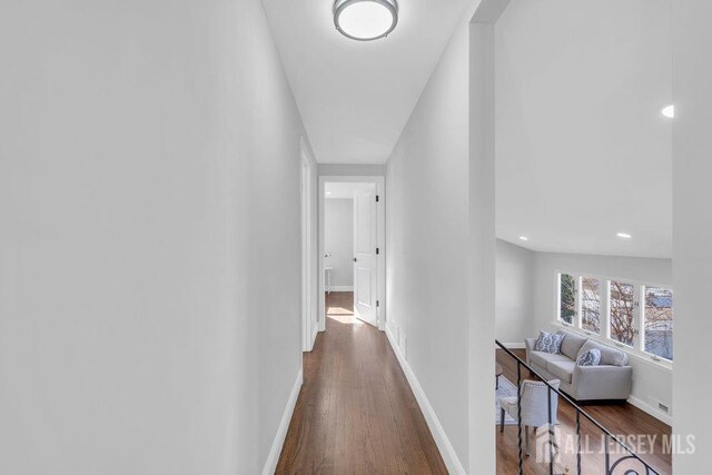 hallway featuring dark hardwood / wood-style floors