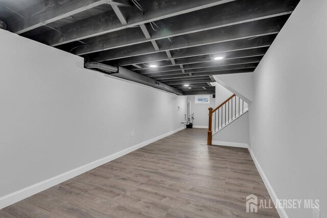 basement featuring wood-type flooring