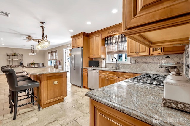 3 Edward Ave, Monroe, NJ 08831 - kitchen featuring stainless steel appliances, a sink, decorative backsplash, a kitchen island, and a ceiling fan
