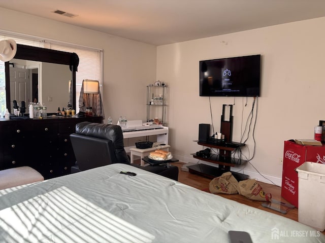 89 Sharot St, Carteret, NJ 07008 - bedroom with baseboards and wood finished floors