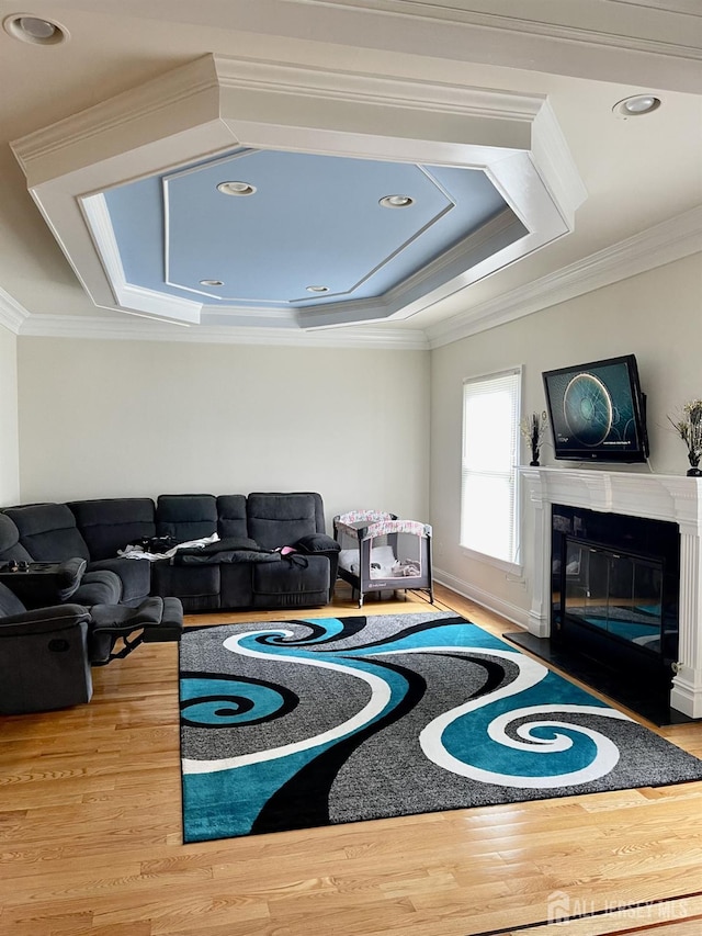 89 Sharot St, Carteret, NJ 07008 - living room with ornamental molding, wood finished floors, a fireplace with flush hearth, and recessed lighting