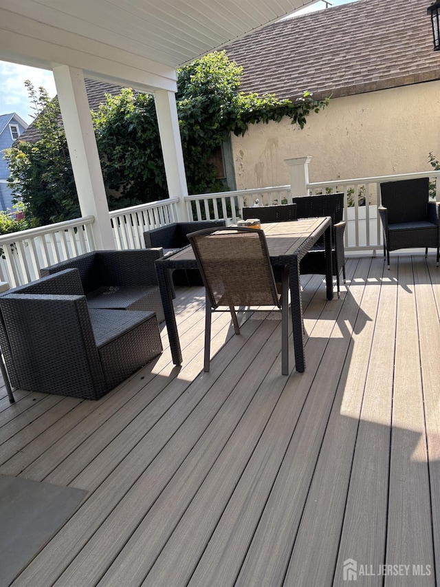 89 Sharot St, Carteret, NJ 07008 - wooden terrace with outdoor dining space and an outdoor living space