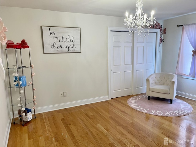 89 Sharot St, Carteret, NJ 07008 - sitting room featuring a chandelier and wood finished floors