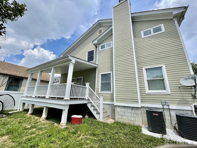89 Sharot St, Carteret, NJ 07008 - back of house with a chimney and a porch