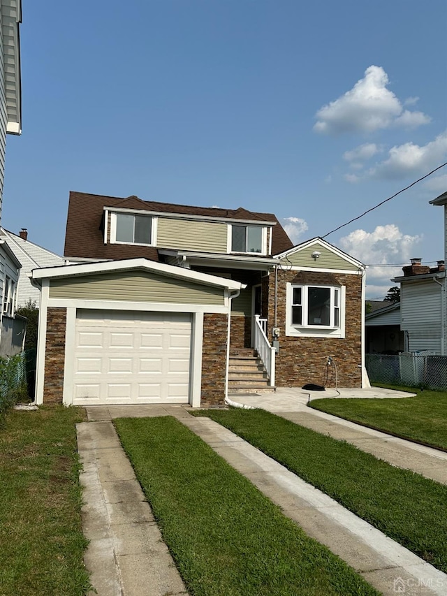 view of front facade featuring a front lawn and a garage