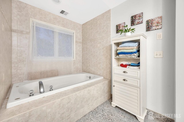 full bathroom with a bath and visible vents