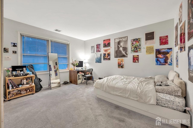 bedroom featuring carpet floors and visible vents