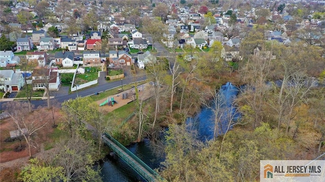 aerial view with a water view and a residential view
