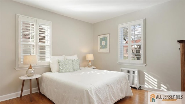 333 Melrose Ave, Middlesex, NJ 08846 - bedroom with radiator heating unit, wood finished floors, and baseboards