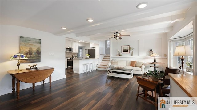 living room with dark wood-style flooring, a ceiling fan, beam ceiling, and recessed lighting