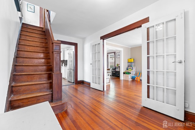 54 5th St, Fords, NJ 08863 - foyer entrance featuring french doors, stairs, and wood finished floors