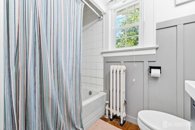 54 5th St, Fords, NJ 08863 - full bathroom featuring radiator, toilet, shower / bath combination with curtain, and wood finished floors