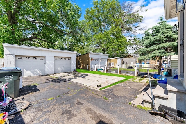 54 5th St, Fords, NJ 08863 - view of patio / terrace featuring an outdoor structure and a garage