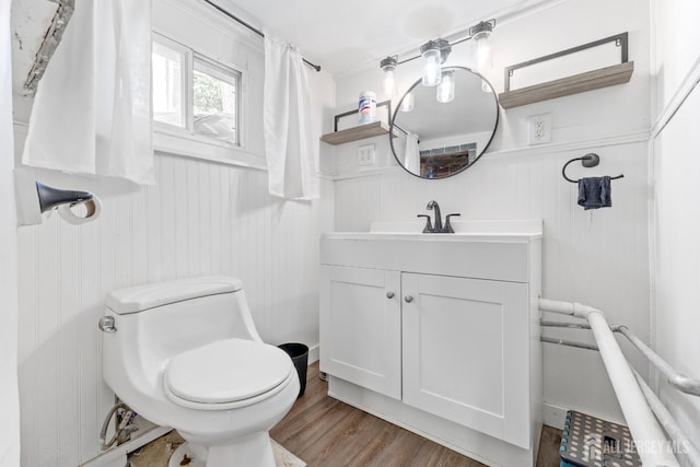 54 5th St, Fords, NJ 08863 - bathroom with vanity, wood finished floors, wainscoting, and a decorative wall