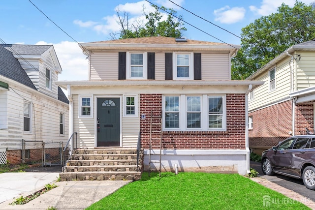 54 5th St, Fords, NJ 08863 - american foursquare style home with entry steps and brick siding