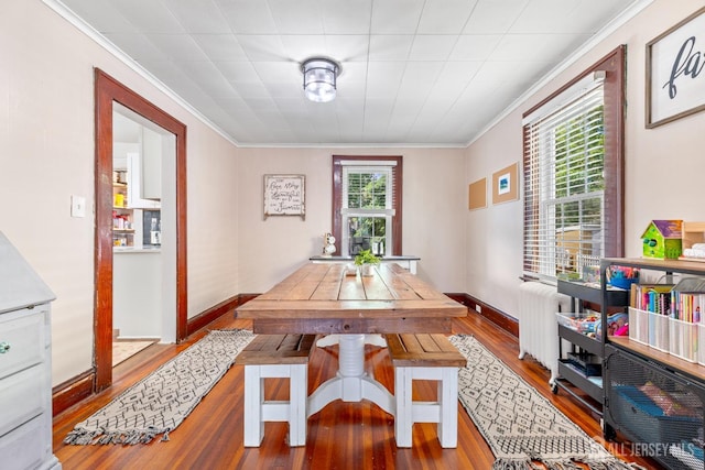 54 5th St, Fords, NJ 08863 - dining area with wood-type flooring, radiator, and crown molding