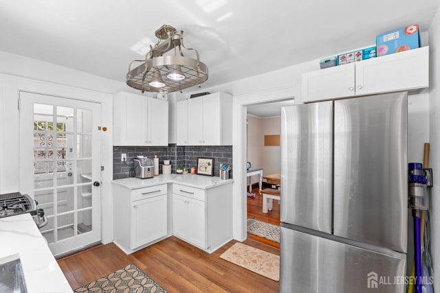 54 5th St, Fords, NJ 08863 - kitchen with appliances with stainless steel finishes, wood finished floors, and white cabinets